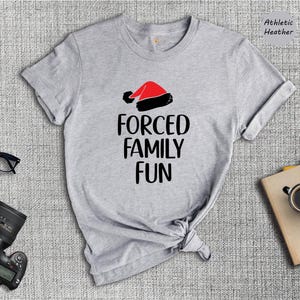 Sarcastic Christmas Family Tee: 'Forced Family Fun' Santa Hat Shirt image 4