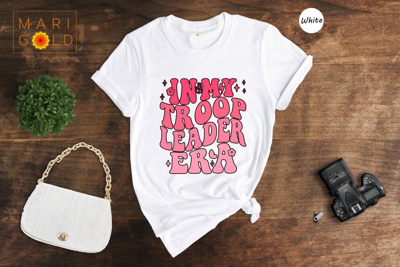 a white t - shirt with pink writing on it