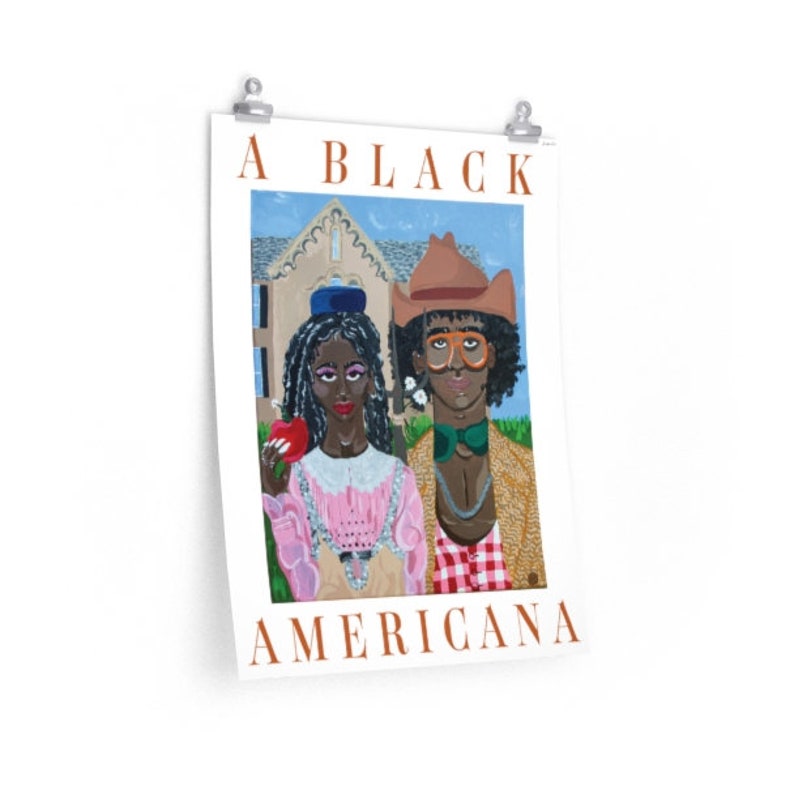 An 18 by 24 inch poster of a painting reminiscent of the classic American Gothic, but with a Black couple wearing 'rural' outfits by Gucci and orange text that reads “A Black Americana.”