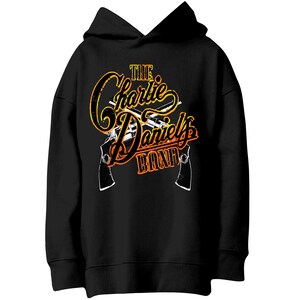 May include: Black hooded sweatshirt with a graphic print of two pistols crossed behind the text "The Charlie Daniels Band" in yellow and orange.