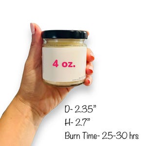 May include: A 4 ounce candle in a clear glass jar with a black lid. The candle is labeled with "4 oz." in pink text. The jar is 2.35 inches in diameter and 2.7 inches tall. The candle has a burn time of 25-30 hours.