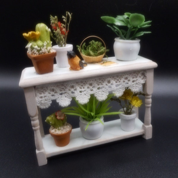 A great little pottery bench with flowers, plants and a bird. Dollhouse miniature 1:12.  3 x 3/4 x 3