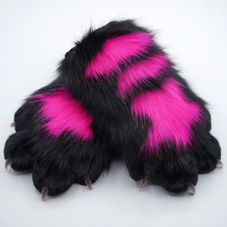 May include: A pair of black and pink furry paws with claws. The paws are made of soft, plush fabric and have a realistic look.
