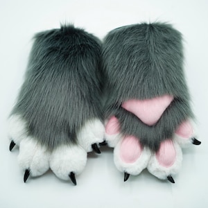 May include: A pair of gray furry paw hand warmers with pink paw pads and black claws.