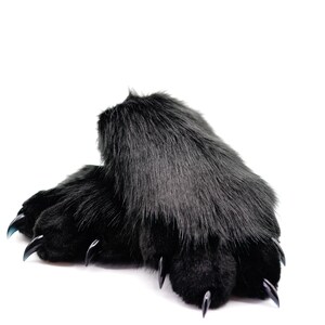 May include: A pair of black fuzzy slippers with black claws. The slippers are made of soft, plush fabric and have a realistic claw design.