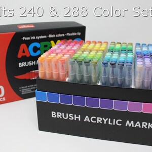 Guangna 240 marker acrylic marker set with the top of the box off and sitting beside the open box. Text overlaid on the image says Fits 240 & 288 Color Sets. The box says Brush Acrylic Marker on the side.