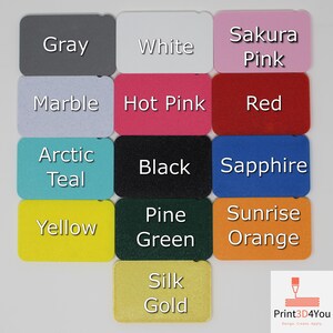Rectangular color samples of the 3D printed filament colors. The colors include gray, white, sakura pink, marble, hot pink, red, arctic teal, black, sapphire, yellow, pine green, sunrise orange, and silk gold. Text is overlaid over the samples to indicate the names of the colors.