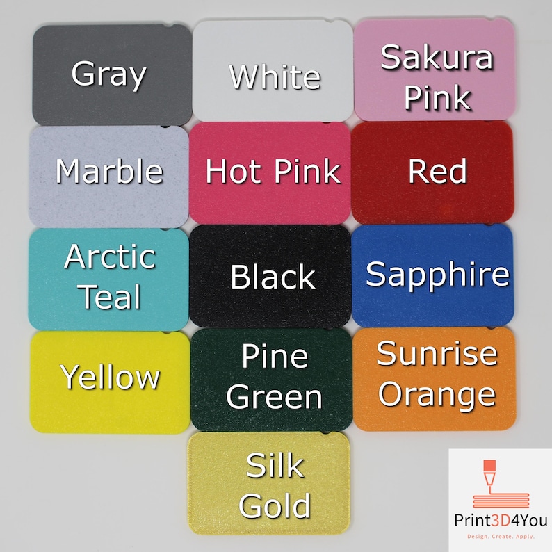 Rectangular color samples of the 3D printed filament colors. The colors include gray, white, sakura pink, marble, hot pink, red, arctic teal, black, sapphire, yellow, pine green, sunrise orange, and silk gold. Text is overlaid over the samples to indicate the names of the colors.