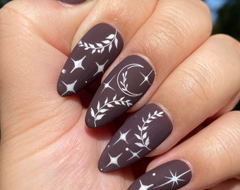 Witchy celestial starry nails-maroon-burgundy press on nails-styled in medium almond