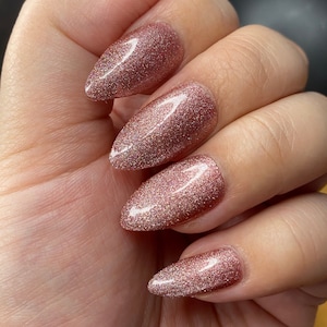 Rose gold pinky velvet crystal press on nails-styled in medium almond