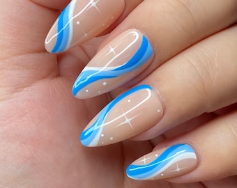 Baby blues abstract swirly nail design-press on nails styled in medium almond