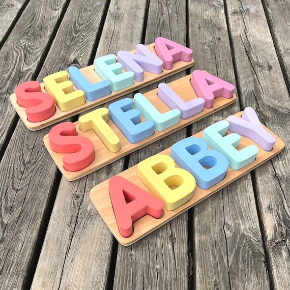 Beautifully hand-painted wooden name puzzles that are both a Montessori learning toy and a keepsake — 304 favorites don't lie.
