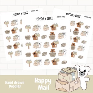 May include: A set of two sheets of stickers featuring a repeating pattern of brown bears and white polar bears holding packages and mailboxes. The text "COCOA & FLUFF" and "HAPPY MAIL" is printed on the sheets. The stickers are designed for use in a planner or journal.