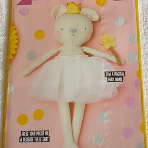 May include: A Christmas Mouse sewing project featuring a cream-coloured mouse doll in a white tulle skirt and a gold crown. Text includes "Christmas Mouse", "Dress your mouse in a delicate tulle skirt", and "Sew a magical fairy wand".