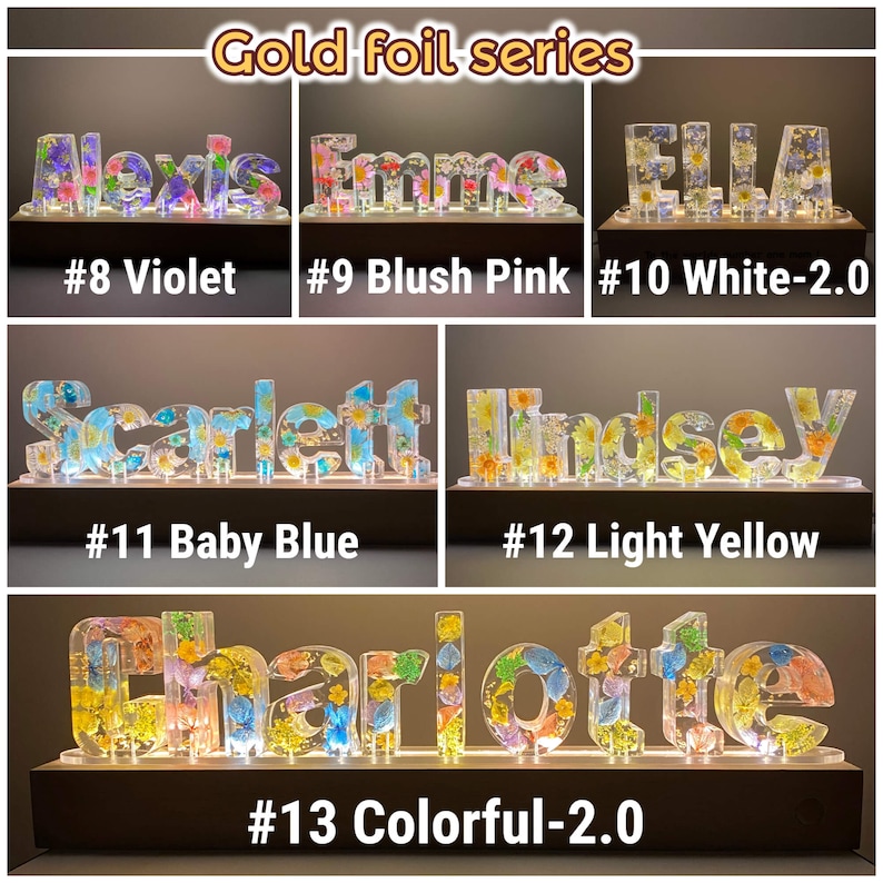 May include: A collection of illuminated name signs with different coloured flowers embedded in the resin. The names are Alexis, Emme, Ella, Scarlett, Lindsey, and Charlotte. The signs are numbered 8 through 13 and have colour descriptions like Violet, Blush Pink, White, Baby Blue, Light Yellow, and Colorful.
