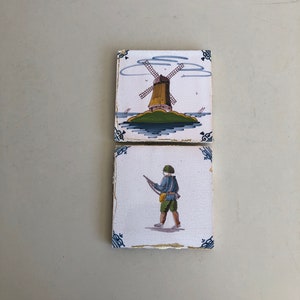 2 Decorative tiles / wall tiles - historical tiles - Delft earthenware polychrome - decor with, among other things, a windmill and a soldier - hand-painted