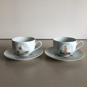 2 cups and saucers / soup bowls - Alliance CNP France - porcelain - with nice images on the saucer and cup