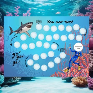 May include: An illustrated game board with an underwater theme, featuring a shark, diver, and coral. The board has a path of white circles, the text "You Got This!", and the words "Start" and "Finish". The words "go, go, go!" are also included.