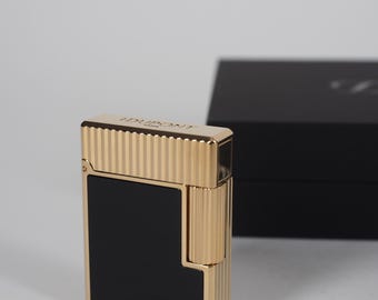 Encendedor S.T. Dupont Línea 1 "CLING" Acabado lacado en dorado y negro C14120 2026