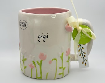 Gigi coffee mug with raised flowers and sculpted butterfly by Rae Dunn