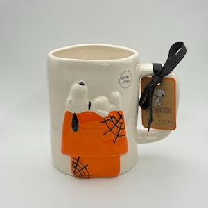 Snoopy Halloween mug by Rae Dunn | 3D Snoopy coffee mug | Snoopy resting on his iconic doghouse in fall colors | Caught in your web mug