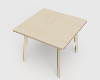 May include: A light wood square coffee table with four legs. The table is made of plywood and has a natural wood finish.