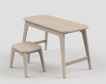 May include: A light-colored wooden desk and matching stool set. The desk has a rectangular top with rounded corners and angled legs. The stool is square with a matching design. The set is made of light-colored wood.