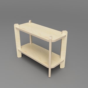 May include: A two-tiered wooden shelf unit with rounded edges and a natural wood finish. The shelf is made of plywood and has a simple, modern design.