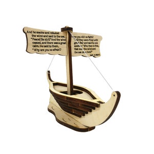 May include: A wooden model of a boat with a sail and a quote from the Bible, "And he awoke and rebuked the wind and said to the sea, 'Peace! Be still!' And the wind ceased, and there was a great calm. He said to them, 'Why are you so afraid? Have you still no faith?' And they were filled with great fear and said to one another, 'Who then is this, that even the wind and the sea obey him?'" Mark 4:39-41