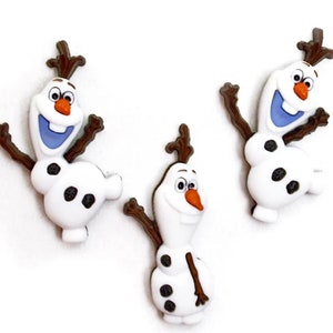 May include: Three white snowman-shaped buttons featuring brown twig-like arms and hair, an orange carrot nose, black coal-like buttons on the torso, and a wide open mouth with a single tooth. Each button depicts a character in a cheerful pose.