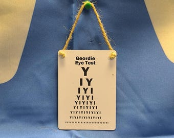 Geordie Eye Test (Metal Dangler)