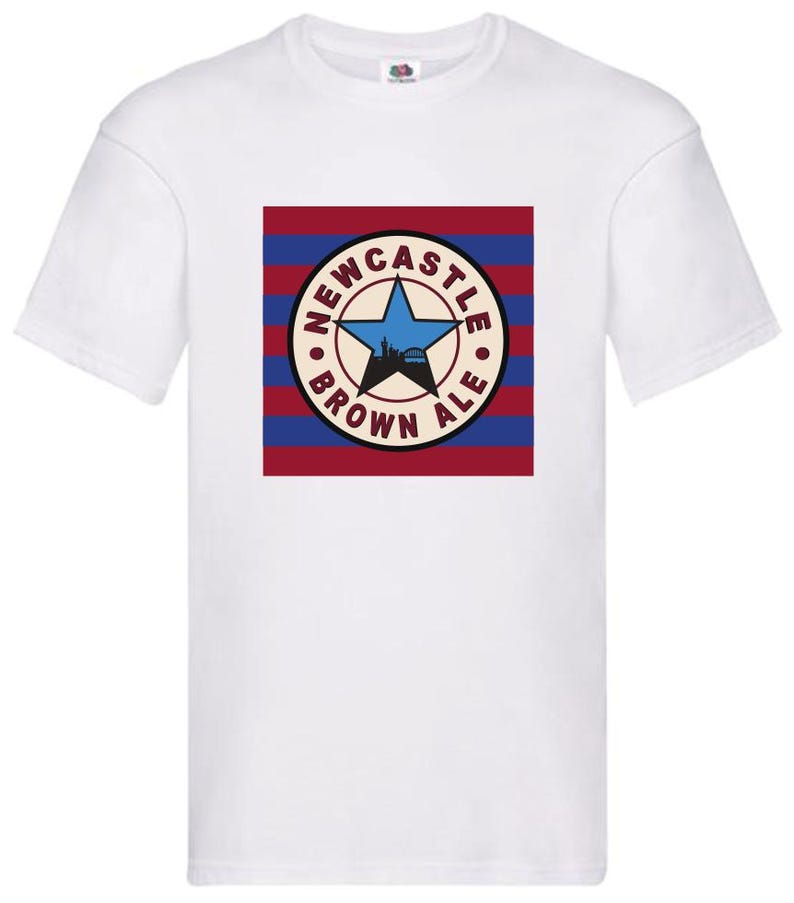 May include: White t-shirt with a red, white, and blue striped background featuring a circular logo with the text "Newcastle Brown Ale" and a star.