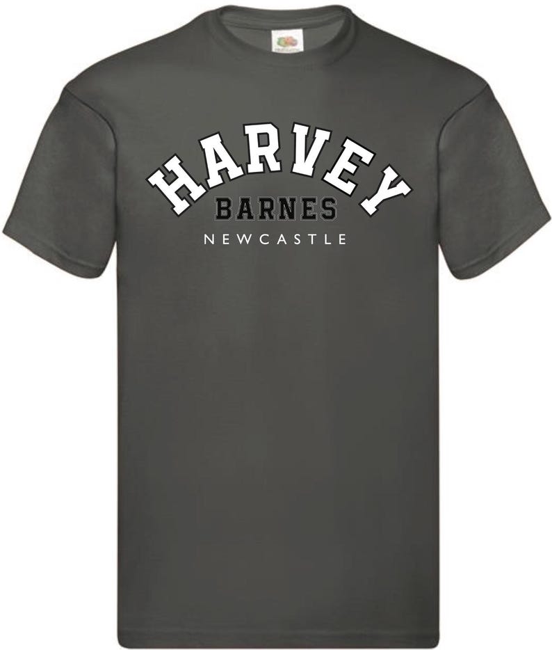 May include: A dark gray t-shirt with a white arched graphic that says "Harvey Barnes Newcastle".