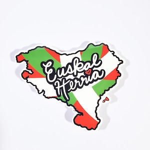 May include: A sticker in the shape of the Basque Country, featuring the Ikurriña flag design in red, green, and white. The sticker has the words "Euskal Herria" in a cursive font.