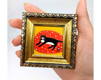 Framed Tuxedo Cat Painting: Hand-Painted Kitten Art on Red Blanket
