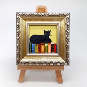 Black Cat Painting: Funny Kitty on Books, Framed Original Art
