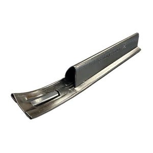 May include: A silver metal gutter guard with a curved design and a small metal tab. The guard has the text "20 GAUGE ALUMINUM" printed on it.
