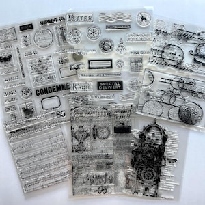 May include: A collection of clear photopolymer stamps featuring vintage-style designs including postal markings, handwritten script, musical notation, a clock tower, and holiday-themed icons like Santa Claus, trees, and the text "Special Delivery."