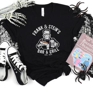 Frank and Stein&#39;s Bar & Grill T-Shirt | Funny Frankenstein Monster Shirt | Vintage Halloween Tee | Gift for Horror Fans | Unisex Casual Top