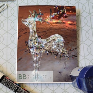 Plié Renne Noël / Lumières de Noël Photographie Carte Brillante