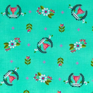 May include: A turquoise fabric with a repeating pattern of white flowers, pink berries, green leaves, and gold trophy cups with the text "I'm a winner" on a black ribbon.