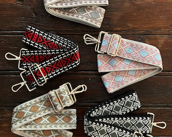 May include: Five different patterned fabric straps with gold metal clasps. The straps are all white with different colored geometric patterns.
