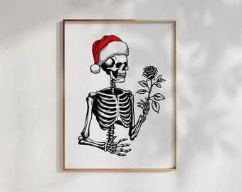 Op de afbeelding: Een zwart-wit illustratie in een lijst van een skelet met een kerstmuts en een roos. Het skelet is gedetailleerd afgebeeld, de roos voegt een vleugje contrast toe. De illustratie staat tegen een witte achtergrond.