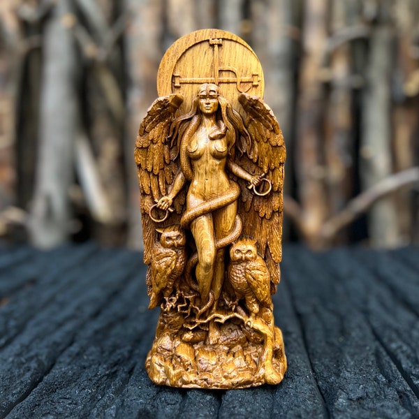 Divine wood carving: a handmade statue of the goddess Lilith, a symbol of feminine power