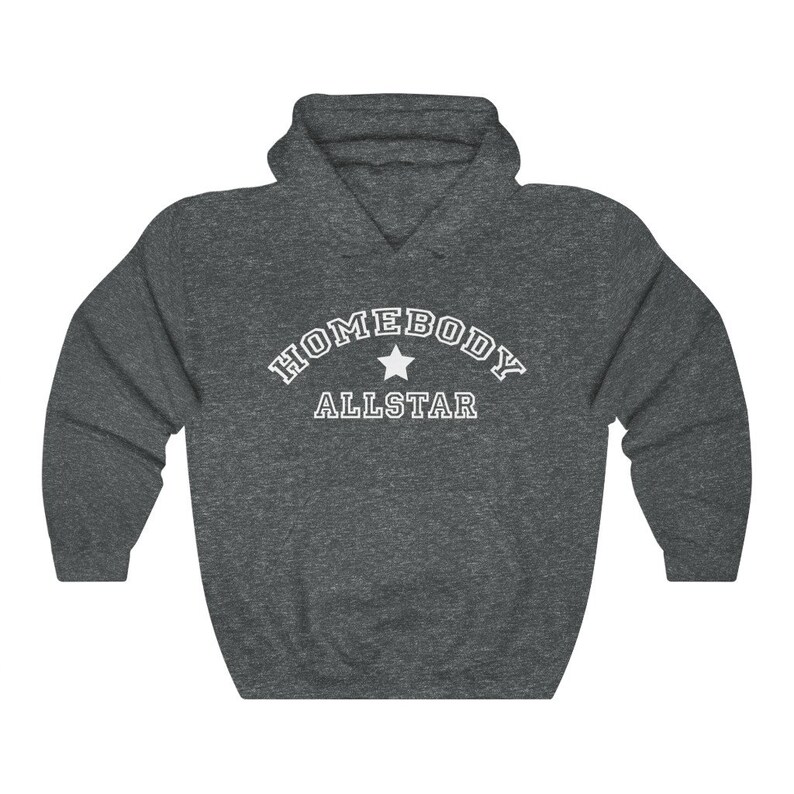 May include: A dark gray hooded sweatshirt with the text "HOMEBODY ALLSTAR" in white with a white star in between the words.