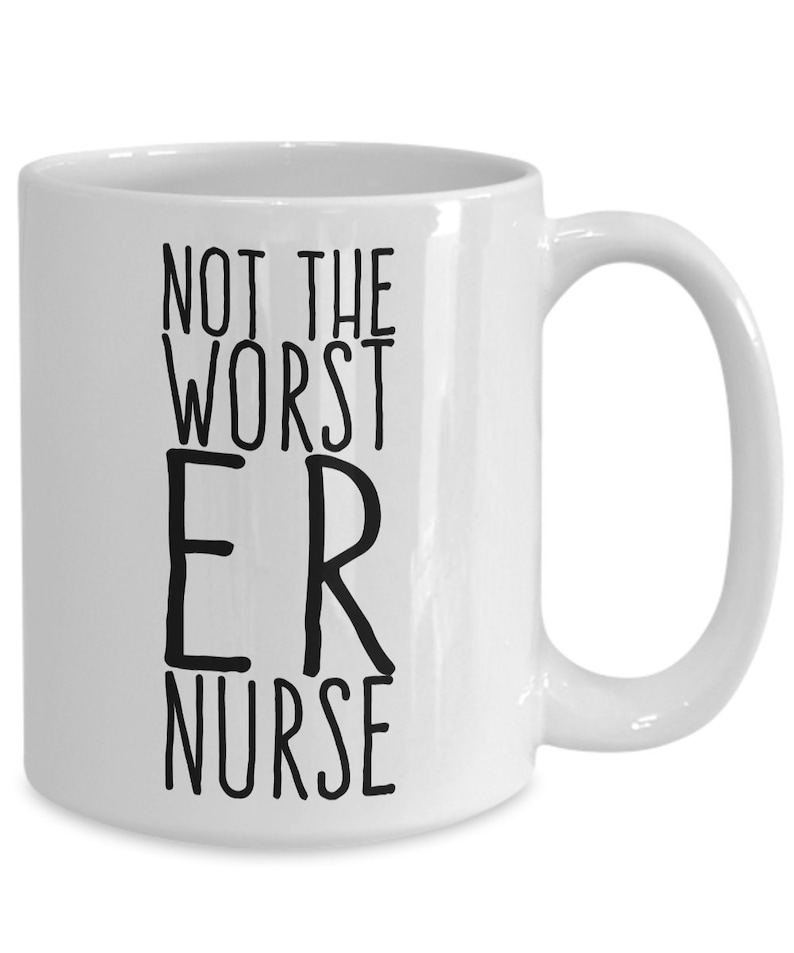 May include: White ceramic coffee mug with black text that reads "Not the worst ER nurse".