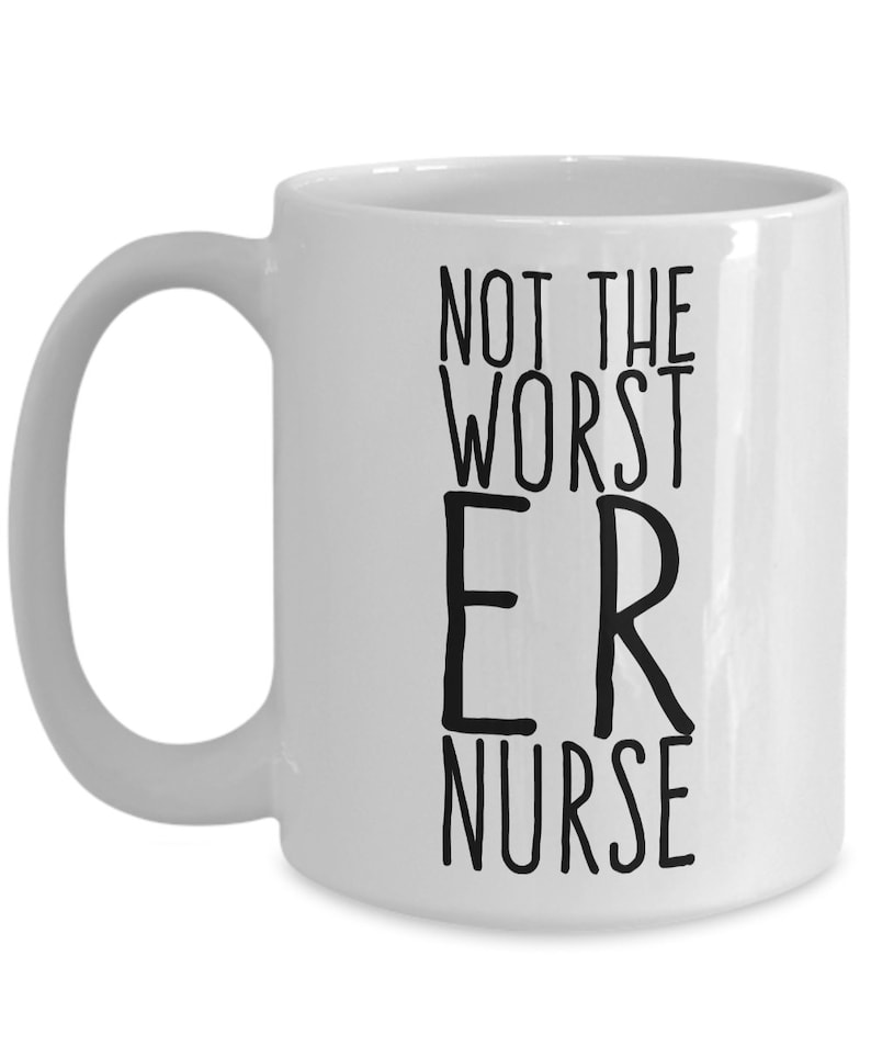 May include: White ceramic coffee mug with a black inscription that reads "Not the worst ER nurse".
