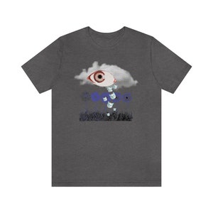 May include: A dark gray t-shirt with a graphic print of a large eye in a cloud with small white cats falling from the cloud.