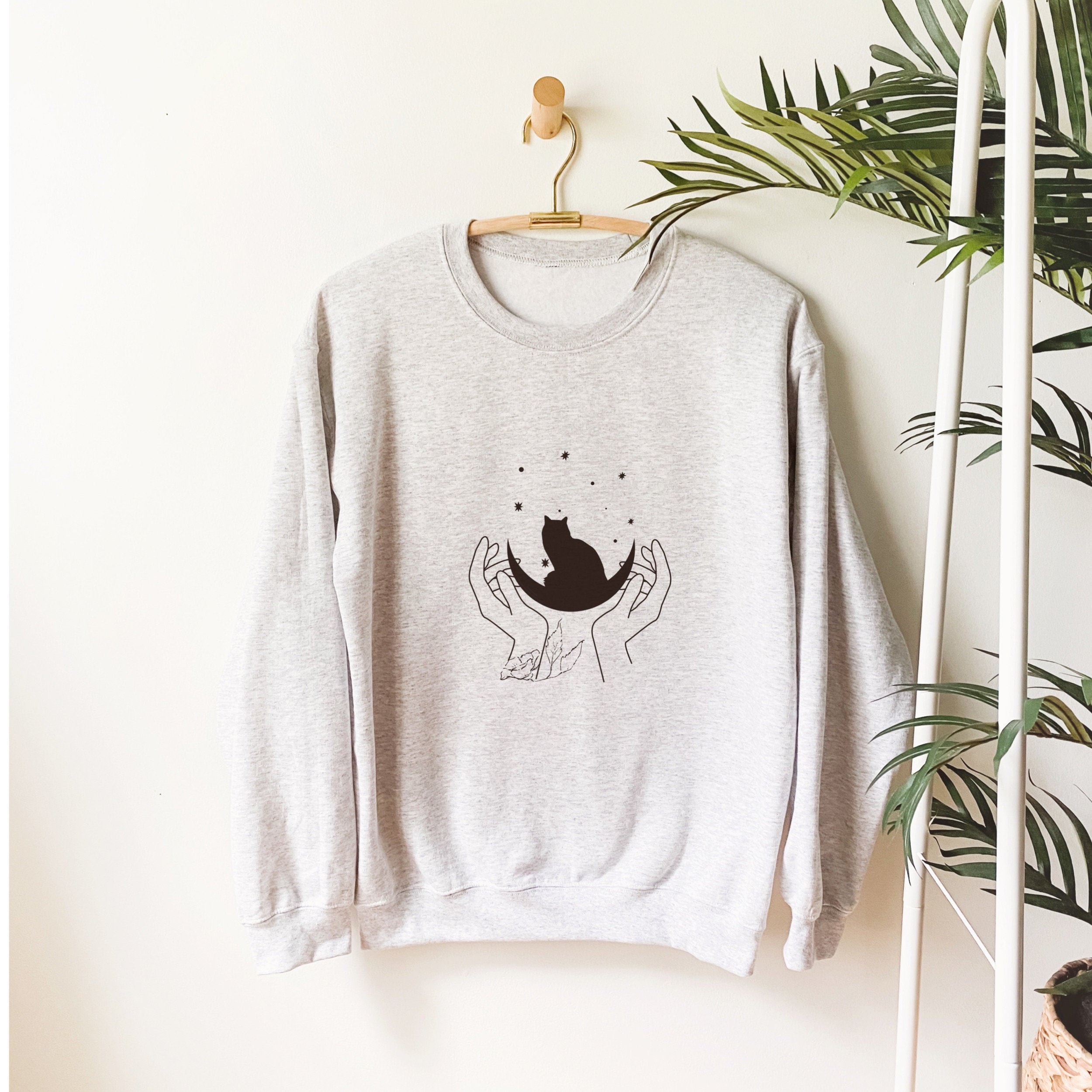 cat looking sweatshirt