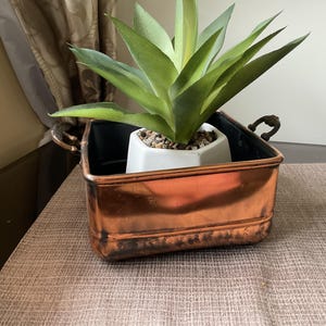 Jardinière en cuivre à deux anses